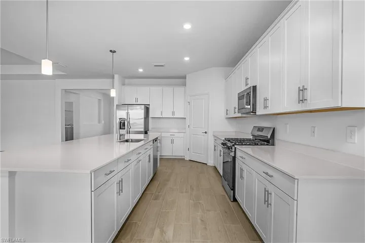 Wood look plank tile flooring throughout the home.