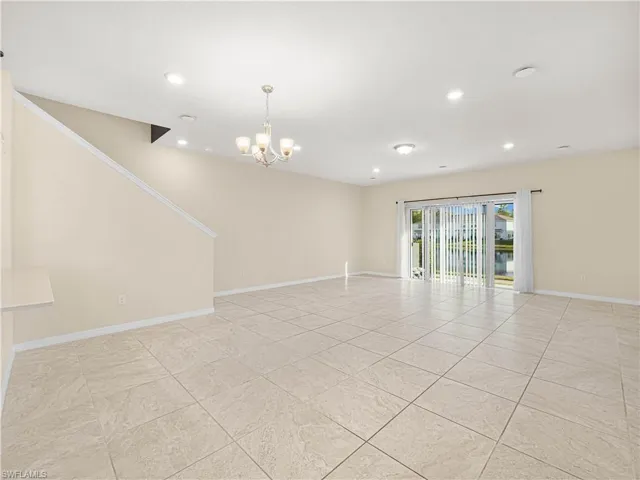 Step inside to discover an inviting open-concept floor plan where natural light fills the living and dining areas