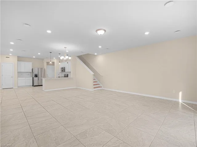 The home offers no carpet, with tile and vinyl flooring throughout for easy maintenance and a clean, modern look.