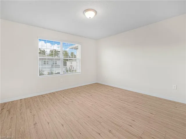 Two additional bedrooms share a full bath, offering plenty of room for family, guests, or a home office.