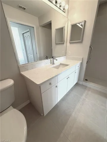 Master Bathroom with Quartz countertop, and shower.