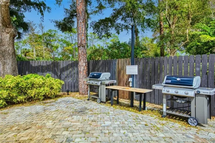 View of patio / terrace featuring a grill and fence