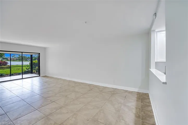 Empty room featuring baseboards