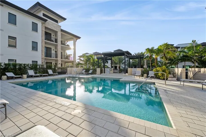 View of pool featuring a pergola and a patio