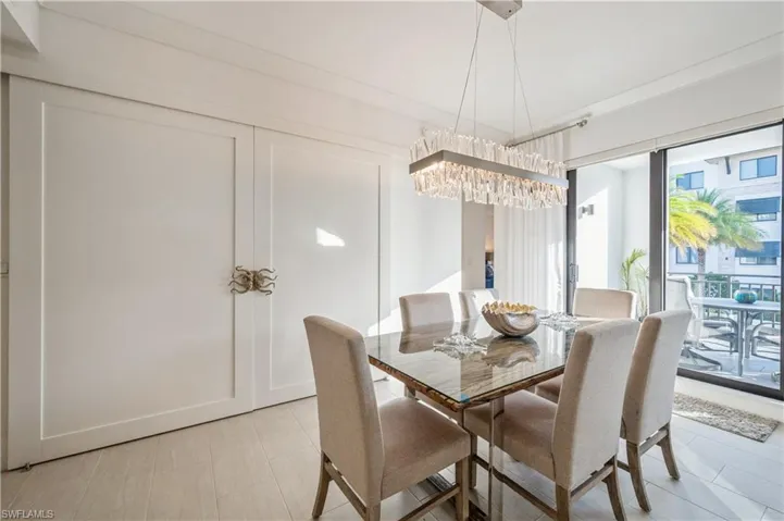 Dining room showcasing the den doors