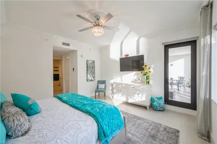 Tiled bedroom with ceiling fan