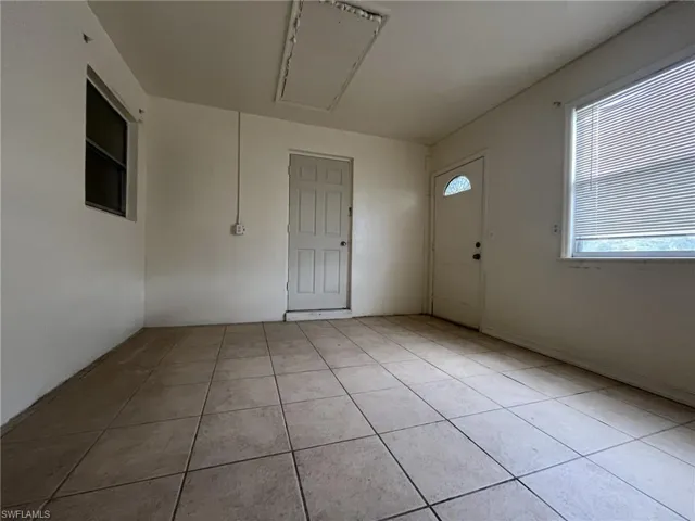 Foyer with light tile patterned floors