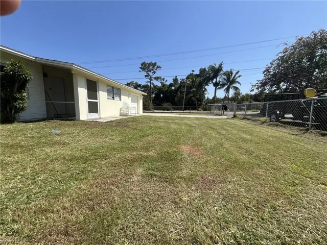 View of yard featuring fence