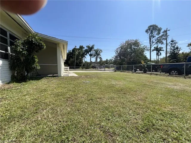 View of yard featuring fence