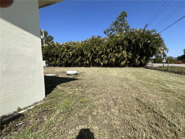 View of yard featuring fence
