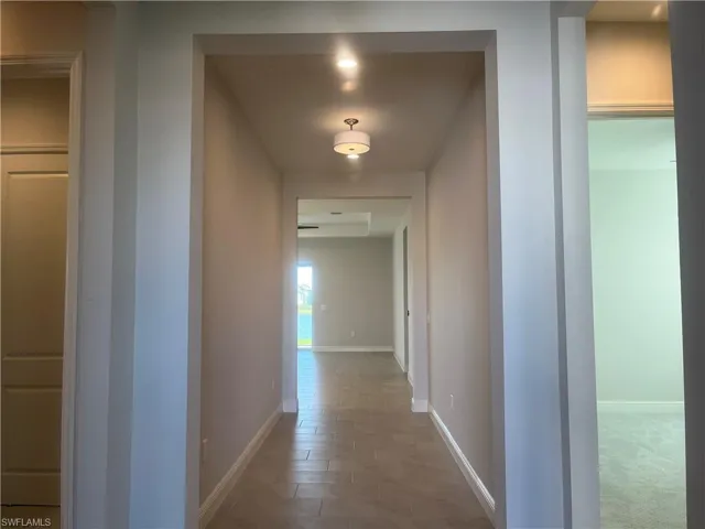 Hall featuring baseboards
