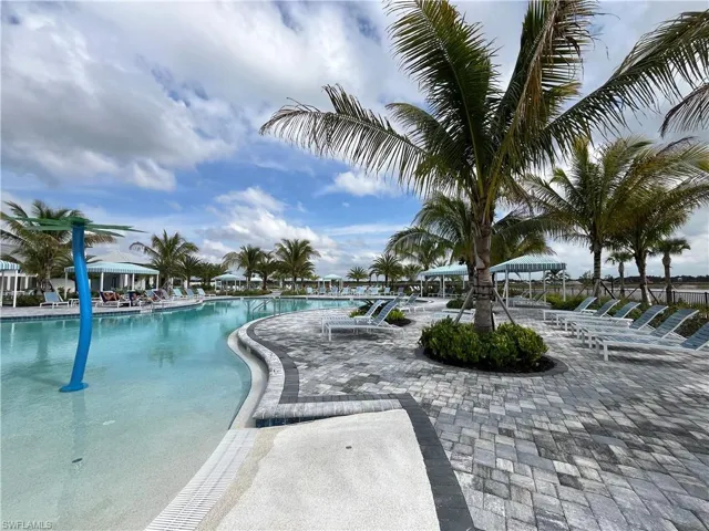 Community pool with a patio