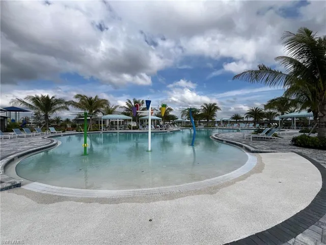 Community pool with a patio