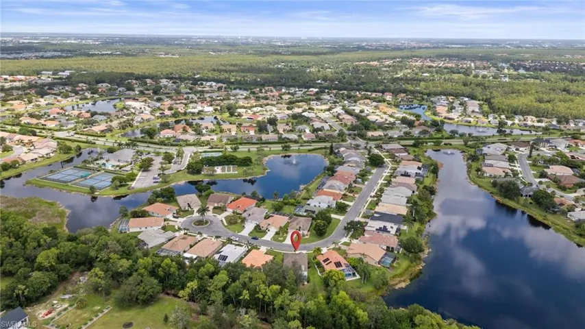 Aerial overview of property's location with nearby suburban area