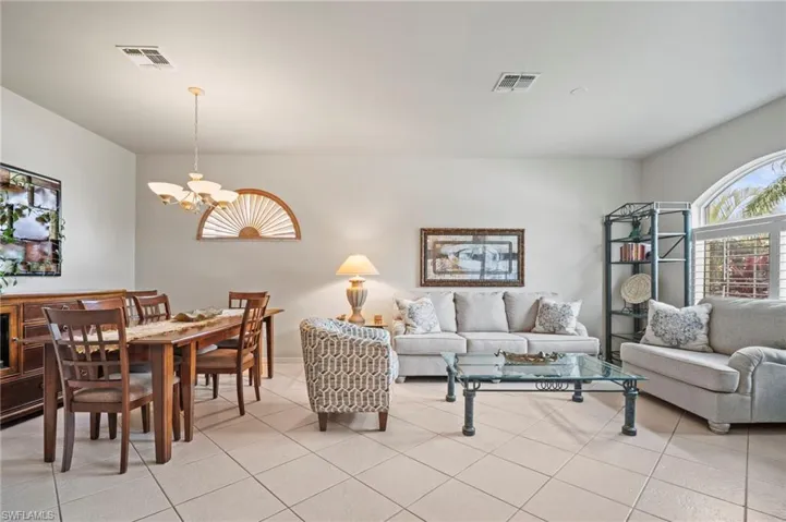 Living room featuring a chandelier and light tile patterned flooring