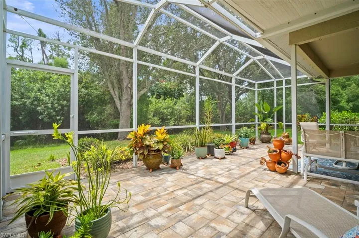 View of patio / terrace with glass enclosure and a sunroom