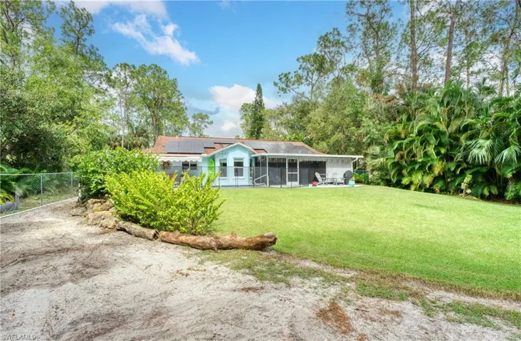 View of yard with a sunroom