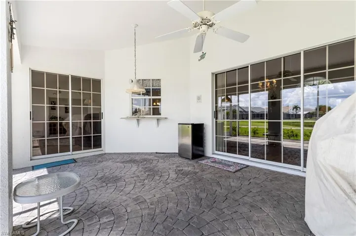 View of patio featuring ceiling fan