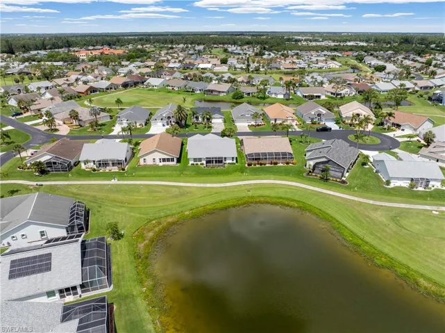 Aerial view of property's location with nearby suburban area