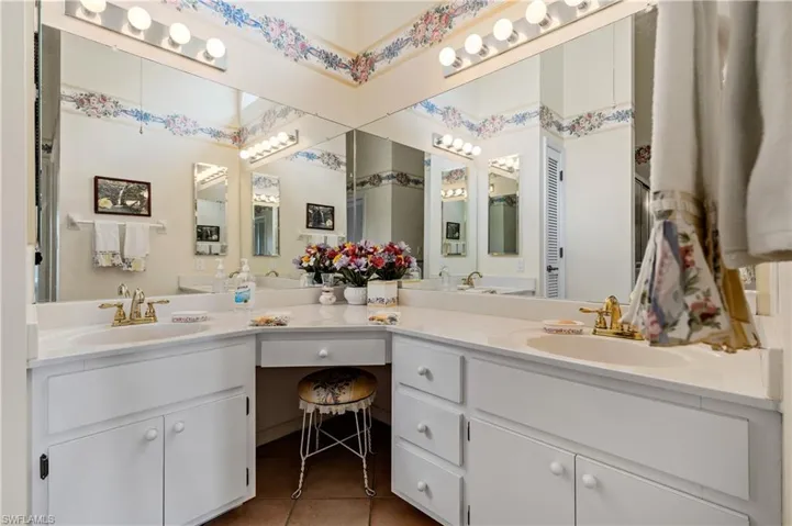 Full bathroom featuring double vanity and tile patterned floors