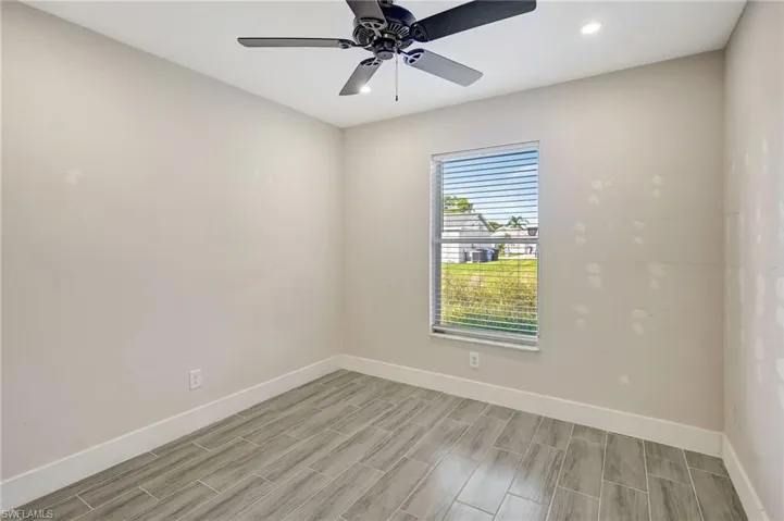 Unfurnished room with recessed lighting, ceiling fan, and wood finish floors