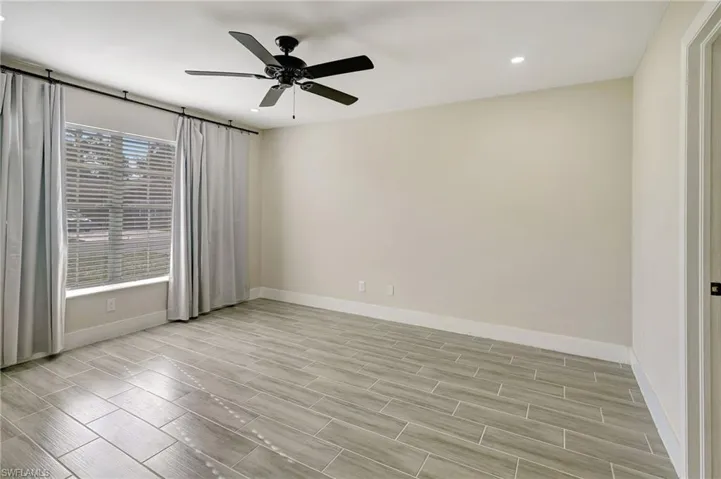 Unfurnished room with wood tiled floors, recessed lighting, and ceiling fan