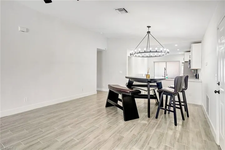 Dining room featuring wood finish floors and recessed lighting