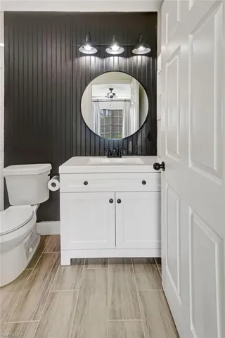 Bathroom with vanity and wood tiled floors