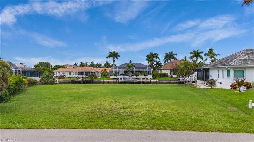 View of yard with a lanai