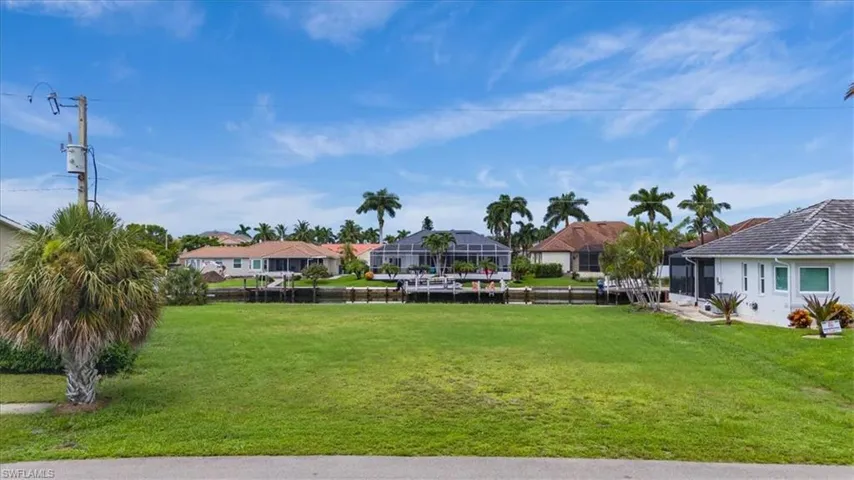 View of yard with glass enclosure
