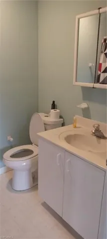 Bathroom with toilet and vanity