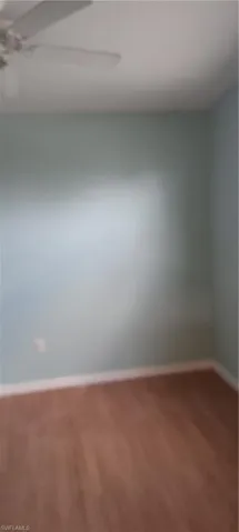 Unfurnished room with baseboards
