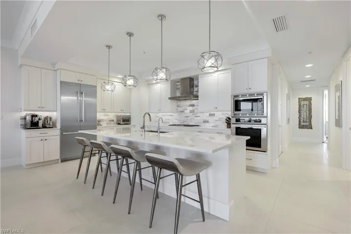 There are never too many “chefs” in the kitchen when preparing a meal in your expansive kitchen.