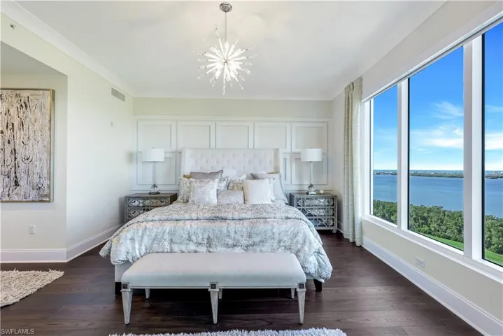The primary bedroom suite boasts lanai access and 2 large closets with custom built-ins.