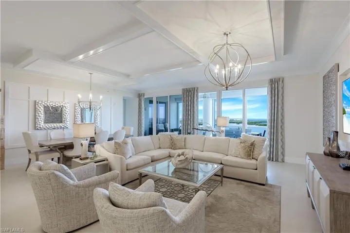The large great room offers floor to ceiling windows with lots of gathering space for friends and family.
