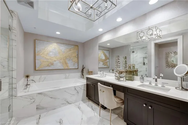 Primary bathroom with dual sinks, extra storage space, walk in shower and soaking tub!