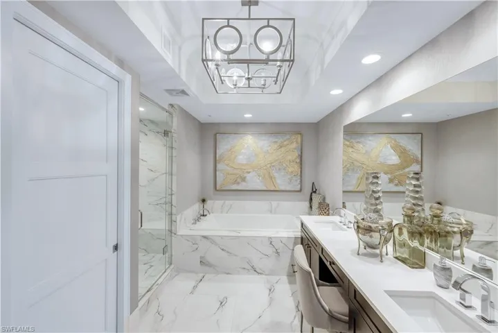 Take a soothing soak at the end of a busy day. Don't forget the glass of wine.