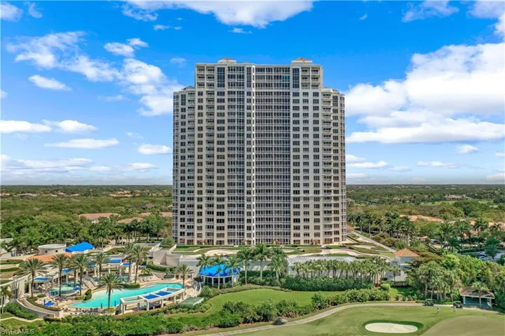 The majestic Seaglass of Bonita Bay towers high above the lush landscaping.