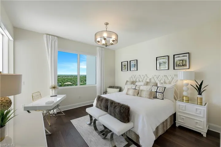 One of two guest bedrooms with an ensuite bathroom and lanai access.