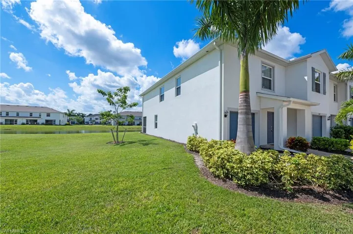 15346 Wildflower Circle Naples, FL 34119 - Side of townhouse adjacent to large common area