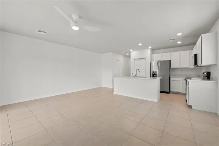 15346 Wildflower Circle Naples, FL 34119 - Kitchen with stainless appliances