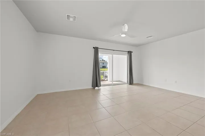 15346 Wildflower Circle Naples, FL 34119 - Fully tiled living area makes cleaning a breeze.