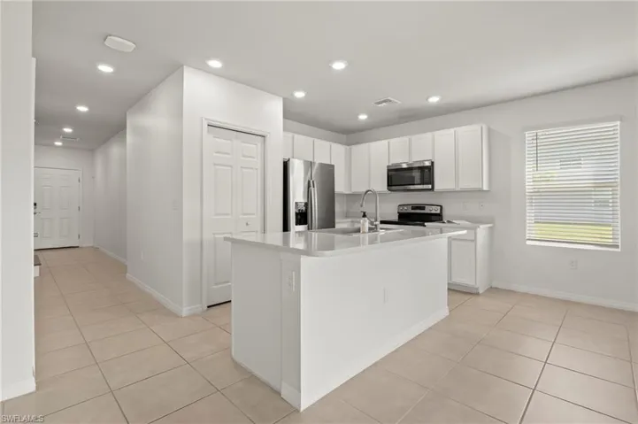 15346 Wildflower Circle Naples, FL 34119 - Open kitchen with pantry and island