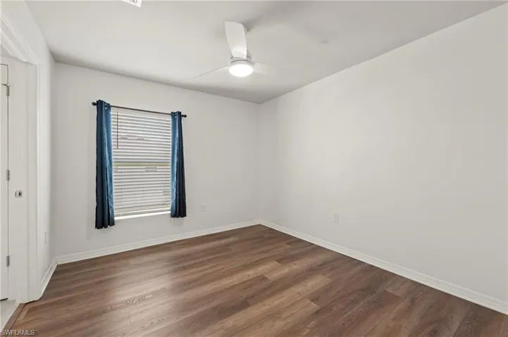 15346 Wildflower Circle Naples, FL 34119 - Bedroom 3 with ceiling fan and light kit