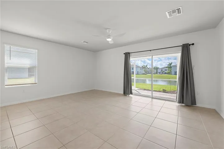 15346 Wildflower Circle Naples, FL 34119 - End unit location adds windows to the living area.