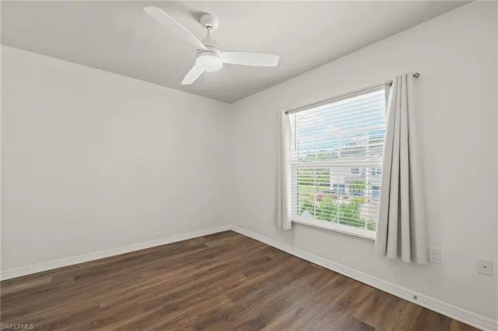 15346 Wildflower Circle Naples, FL 34119 - Bedroom 2 with ceiling fan and light kit