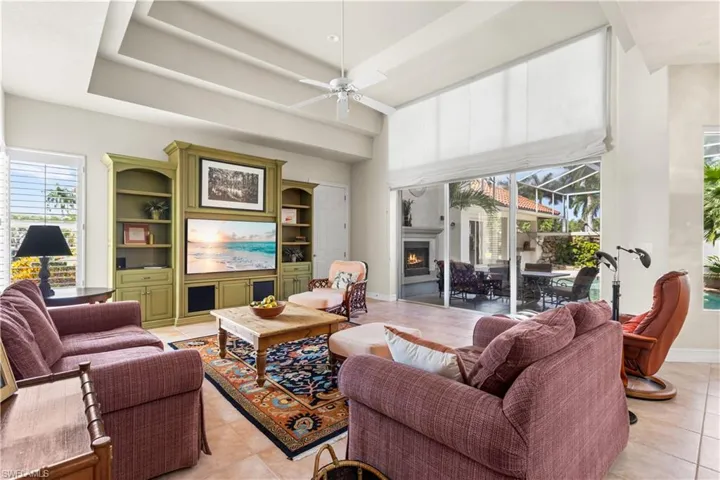 This is an additional living area that your kitchen overlooks. Triple tray ceilings and access to your courtyard.