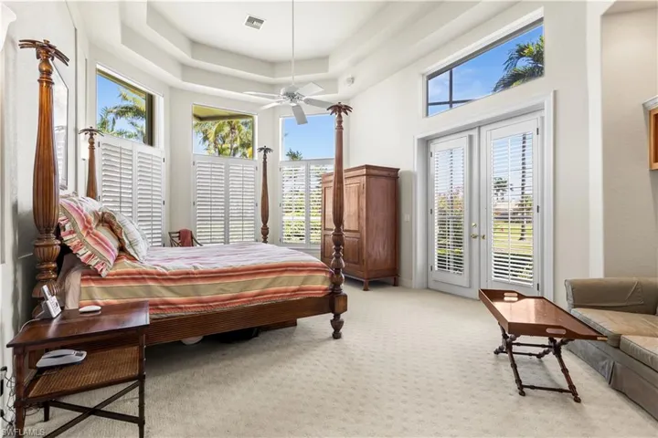 Master wind has a cozy seating area. Transom windows to let the natural light spill in!