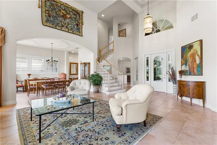 These 16 ft soaring ceilings with coffered ceilings welcome you as you enter this spctacualr home.