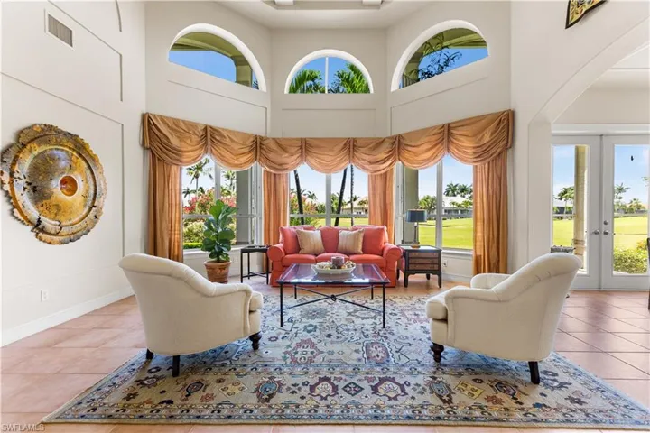 As you enter your front door this is your breathtaking view of the 2nd hole and golf course! Lots of natural light comes into this area! French doors lead to an additional screened in lanai.